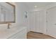Bathroom with white vanity and built in closet at 1543 Gorham St, North Port, FL 34288