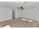 Bright bedroom with ceiling fan and wood-look flooring at 1543 Gorham St, North Port, FL 34288