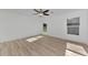 Spacious bedroom featuring a ceiling fan and large window at 1543 Gorham St, North Port, FL 34288