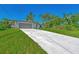Newly built home with long driveway and spacious lawn at 1543 Gorham St, North Port, FL 34288