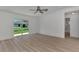 Main bedroom with sliding glass doors to backyard at 1543 Gorham St, North Port, FL 34288