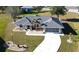 Single-story home with a two-car garage and landscaped yard at 16129 Coruna Ct, Punta Gorda, FL 33955