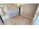 Bedroom with wood-look floors and large window at 16129 Coruna Ct, Punta Gorda, FL 33955