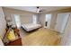 Bright bedroom with wood-look floors and ceiling fan at 16129 Coruna Ct, Punta Gorda, FL 33955