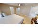 Bedroom with wood-look floors and ceiling fan at 16129 Coruna Ct, Punta Gorda, FL 33955