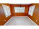 Bright breakfast nook with orange walls and tile floor at 16129 Coruna Ct, Punta Gorda, FL 33955