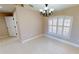 Spacious dining room with tile floor and large window at 16129 Coruna Ct, Punta Gorda, FL 33955