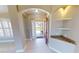 Bright entryway with tiled floor and built-in shelving at 16129 Coruna Ct, Punta Gorda, FL 33955