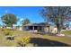 House exterior showcasing landscaping and screened lanai at 16129 Coruna Ct, Punta Gorda, FL 33955