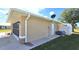 Attached garage with screened enclosure and AC unit at 16129 Coruna Ct, Punta Gorda, FL 33955