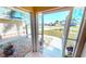 Relaxing screened porch with view of neighborhood at 16129 Coruna Ct, Punta Gorda, FL 33955