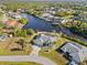 Aerial view showcasing the home's location on the canal at 17456 Foremost Ln, Port Charlotte, FL 33948