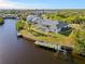 Aerial view of home showcasing pool and canal view at 17456 Foremost Ln, Port Charlotte, FL 33948