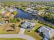 Aerial view of the house and surrounding canal-front property at 17456 Foremost Ln, Port Charlotte, FL 33948