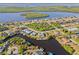 Aerial view of canal-front home with neighborhood and water access at 17456 Foremost Ln, Port Charlotte, FL 33948