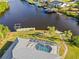 Aerial view of property highlighting the pool and canal access at 17456 Foremost Ln, Port Charlotte, FL 33948