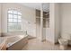 Bathroom with tub, toilet and shower at 17456 Foremost Ln, Port Charlotte, FL 33948