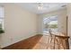 Bedroom with pool view, wood floors, and small table and chairs at 17456 Foremost Ln, Port Charlotte, FL 33948