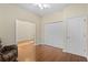 Bright bedroom with wood floors and access to another room at 17456 Foremost Ln, Port Charlotte, FL 33948