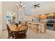 Cozy dining area adjacent to kitchen, featuring wood table and chairs at 17456 Foremost Ln, Port Charlotte, FL 33948