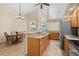 Kitchen with stainless steel appliances and wood cabinetry at 17456 Foremost Ln, Port Charlotte, FL 33948