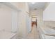Bright laundry room with built-in shelving and a washer/dryer at 17456 Foremost Ln, Port Charlotte, FL 33948