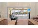 Living room with wood floors, sliding doors, and pool view at 17456 Foremost Ln, Port Charlotte, FL 33948