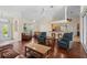 Open living room with hardwood floors and kitchen access at 17456 Foremost Ln, Port Charlotte, FL 33948
