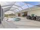 Enjoy this refreshing pool area, complete with a covered lanai and grilling station at 17456 Foremost Ln, Port Charlotte, FL 33948