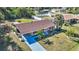 Aerial view of single story home with landscaped yard and driveway at 19071 Helena Ave, Port Charlotte, FL 33948