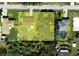 Aerial view showing a lot with four houses and surrounding landscape at 19071 Helena Ave, Port Charlotte, FL 33948