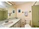 Bathroom with beige tile, a single sink vanity, and shower at 19071 Helena Ave, Port Charlotte, FL 33948