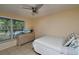 Bright bedroom with tiled floor, double window, and dresser at 19071 Helena Ave, Port Charlotte, FL 33948