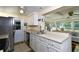 Kitchen with stainless steel appliances and light-colored cabinets at 19071 Helena Ave, Port Charlotte, FL 33948