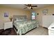 Main bedroom with leafy bedding and a neutral color scheme at 19071 Helena Ave, Port Charlotte, FL 33948
