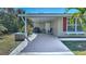 Covered patio with grill and seating area at 19071 Helena Ave, Port Charlotte, FL 33948