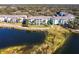 Waterfront community with teal buildings and lush landscape at 19375 Water Oak Dr # 203, Port Charlotte, FL 33948