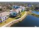Apartment buildings alongside a lake, offering scenic views at 19375 Water Oak Dr # 203, Port Charlotte, FL 33948