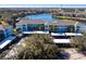 Complex of teal apartment buildings near a lake at 19375 Water Oak Dr # 203, Port Charlotte, FL 33948