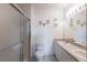 Bathroom with double vanity, shower, and tiled floors at 19375 Water Oak Dr # 203, Port Charlotte, FL 33948