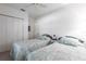 Guest bedroom with twin beds and closet at 19375 Water Oak Dr # 203, Port Charlotte, FL 33948
