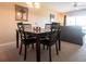 Dining area with four chairs and a framed picture on wall at 19375 Water Oak Dr # 203, Port Charlotte, FL 33948