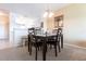Dining area with four chairs and a view into the kitchen at 19375 Water Oak Dr # 203, Port Charlotte, FL 33948