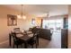 Bright dining area with a four-person table and access to the living room at 19375 Water Oak Dr # 203, Port Charlotte, FL 33948