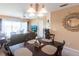 Dining area with a dark wood table and four chairs at 19375 Water Oak Dr # 203, Port Charlotte, FL 33948