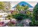 Landscaped grounds with a pond and waterfall feature at 19375 Water Oak Dr # 203, Port Charlotte, FL 33948