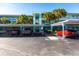 Covered parking area with several cars parked underneath at 19375 Water Oak Dr # 203, Port Charlotte, FL 33948