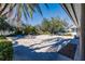 Community patio area with seating and views of the lake at 19375 Water Oak Dr # 203, Port Charlotte, FL 33948
