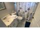 Bathroom with toilet, vanity, and shower at 2210 Cooper St # F3, Punta Gorda, FL 33950