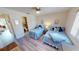 Guest bedroom with two twin beds and en-suite bathroom at 22375 Edgewater Dr # 147, Punta Gorda, FL 33980